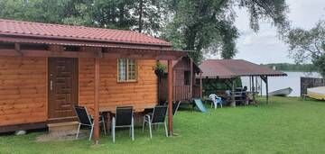 Фото номера Дом с 2 спальнями Дома для отпуска Domek drewniany nad jeziorem г. Zełwągi 22