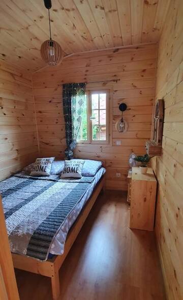 Фото номера Дом с 2 спальнями Дома для отпуска Domek drewniany nad jeziorem г. Zełwągi 7